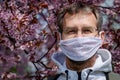 Portrait of a man in a mask under a tree Royalty Free Stock Photo