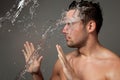 Portrait of a man under the water jets