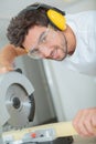 Portrait man using circular saw Royalty Free Stock Photo
