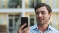 Portrait man using phone for video chat. Businessman making video call outside Royalty Free Stock Photo