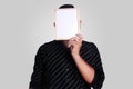 Young Asian Man Covering His Face With Small Whiteboard Royalty Free Stock Photo