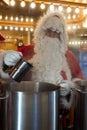 portrait of man wearing a santa claus costume at the mulled wine cabin at the christmas Royalty Free Stock Photo