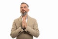 Portrait of man wearing smart casual clothes praying Royalty Free Stock Photo