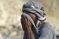 Portrait of a man wearing traditional head scarf in Aden, Yemen.