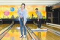 portrait man and woman cleaning bowling alley Royalty Free Stock Photo