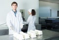 Portrait of man and woman dressed in lab coats are looking happy Royalty Free Stock Photo