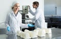 Portrait of man and woman dressed in lab coats are looking happy Royalty Free Stock Photo