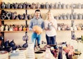 Portrait of man and woman shopping ceramic utensil in boutique Royalty Free Stock Photo