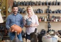 portrait of man and woman shopping ceramic utensil in boutique Royalty Free Stock Photo