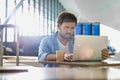 Portrait of man working with his laptop in cafe at airport while waiting for his flight Royalty Free Stock Photo