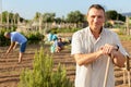 Portrait of man with working tool in backyard garden Royalty Free Stock Photo