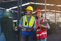 A portrait of a manufacturing worker in discussion with an industrial man and woman engineer holding a tablet in a factory. A Royalty Free Stock Photo