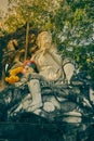 Portrait Marble Sun Wukong or Monkey King Statue on Stone and Baton in Vintage Tone Royalty Free Stock Photo