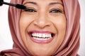 Portrait, mascara brush and woman in hijab for facial beauty, skincare and cosmetics in studio with smile. Face of happy Royalty Free Stock Photo