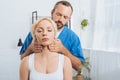 portrait of massage therapist massaging neck of young woman Royalty Free Stock Photo