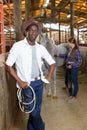 Afro man horse farm worker Royalty Free Stock Photo