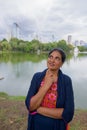 Portrait of mature Indian woman thinking at park Royalty Free Stock Photo