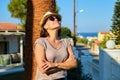 Portrait of mature beautiful smiling woman on vacation, summer tropical landscape Royalty Free Stock Photo