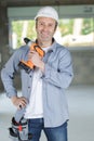 portrait mature builder holding cordless drill Royalty Free Stock Photo