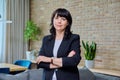 Portrait of mature business confident woman in office