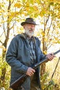 Senior hunter with gun ready to shoot his rifle Royalty Free Stock Photo