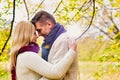 Portrait of Mature couple enjoying autumn while showing affection in park