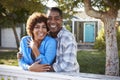 Portrait Of Mature Couple Looking Over Back Yard Fence Royalty Free Stock Photo