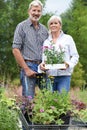 Portrait Of Mature Couple Shopping At Garden Center Royalty Free Stock Photo