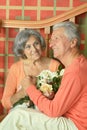 Mature couple with bouquet of flowers Royalty Free Stock Photo