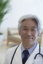 Portrait of mature doctor looking at camera and smiling Royalty Free Stock Photo