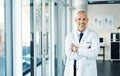 Hes got years of experience behind his name. Portrait of a mature doctor standing in a hospital. Royalty Free Stock Photo
