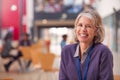 Portrait Of Mature Female Teacher Or Student Working At Table In College Hall Royalty Free Stock Photo