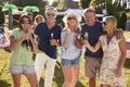 Portrait Of Mature Friends Enjoying Drinks At Summer Garden Fete Royalty Free Stock Photo