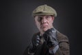 Portrait of a mature gangster with his fists up ready to punch Royalty Free Stock Photo