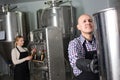 Portrait of mature glad male brewery worker