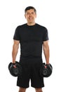 Portrait of Mature Hispanic Man Holding Dumbbells