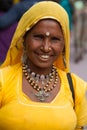 portrait of Mature Indian woman in yellow blouse and yellow veil