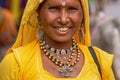 portrait of Mature Indian woman in yellow blouse and yellow veil