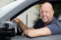 portrait mature male driver at wheel