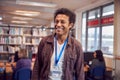 Portrait Of Mature Male Teacher Or Student In Library With Other Students Studying In Background Royalty Free Stock Photo