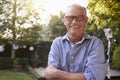 Portrait Of Mature Man In Back Yard Garden Royalty Free Stock Photo