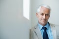 Portrait, mature man and corporate in suit with copy space, confidence and serious look with determination at office Royalty Free Stock Photo