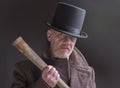 Sinister Victorian criminal holding a wooden bat