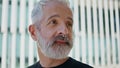 Portrait mature man drinking morning coffee on street. Brutal grey hair male Royalty Free Stock Photo