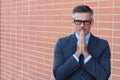 Portrait of mature man praying with copy space Royalty Free Stock Photo