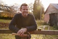 Portrait Of Mature Man Repairing Garden Fence Royalty Free Stock Photo