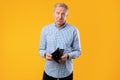 Portrait of mature man showing his empty wallet Royalty Free Stock Photo