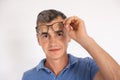 Portrait of mature man taking off eyeglasses looking at camera Royalty Free Stock Photo