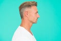 Portrait of mature man. well groomed guy in profile view. handsome male has perfect skin on his face. new dye haircut