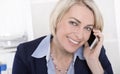 Portrait of a mature or senior business woman flirting on mobile Royalty Free Stock Photo